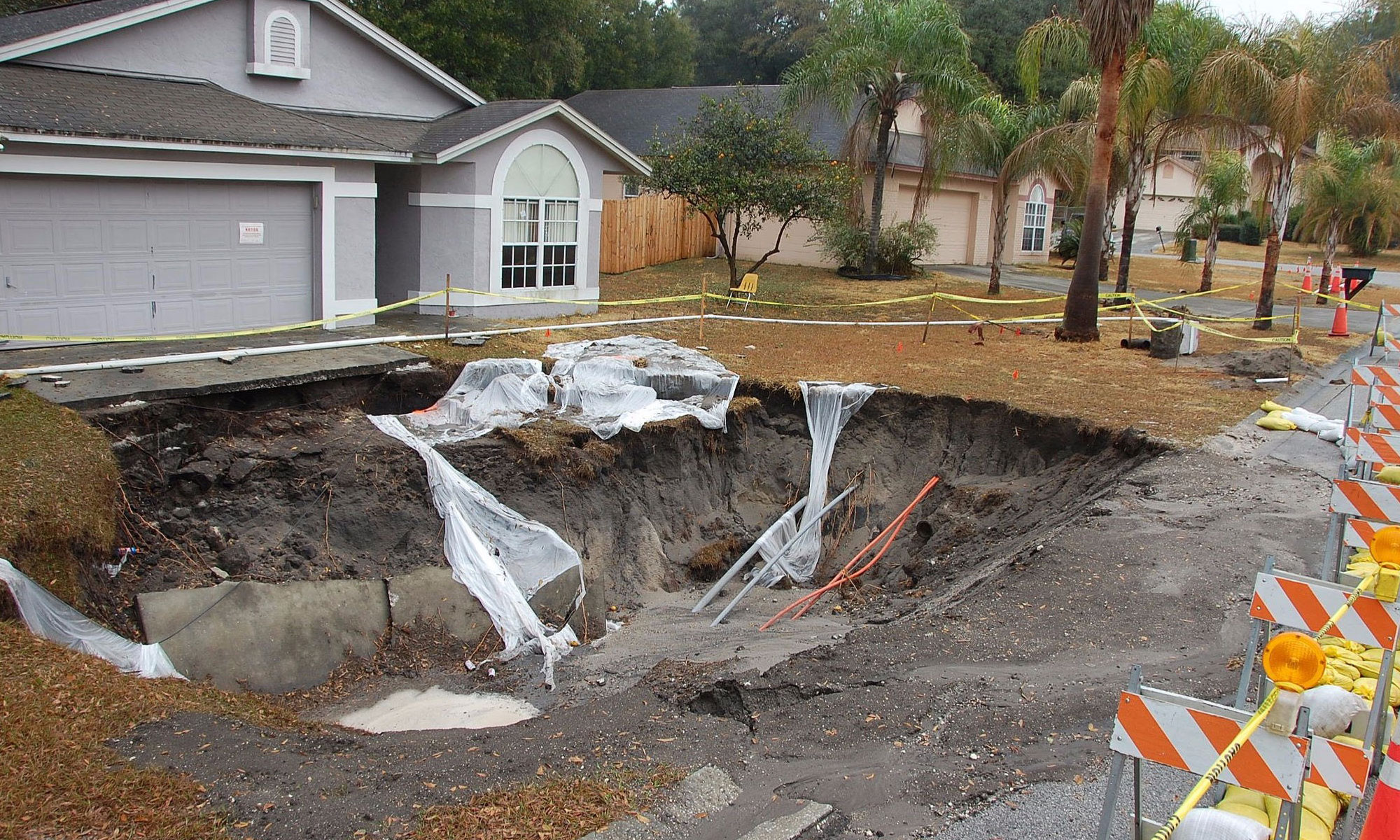 large sinkhole in front of home